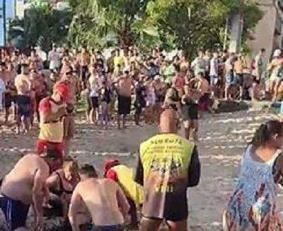 Piloto de parapente bate em pr&eacute;dio e cai sobre banhistas na praia de Caiob&aacute;, no Litoral do Paran&aacute;